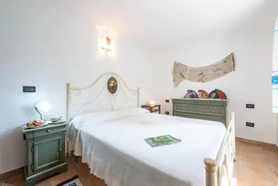 Letto o letti in una camera di Al mare a Capo Comino