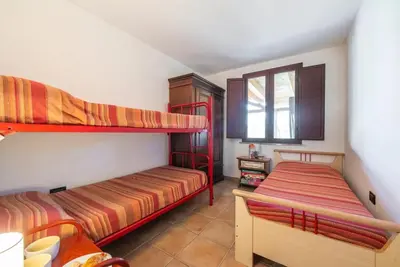 Letto o letti in una camera di Al mare a Capo Comino