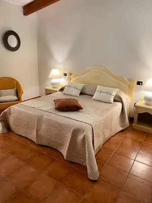 Letto o letti in una camera di Zeta Club San Teodoro Le Rose