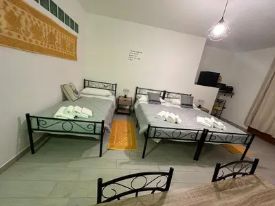 Letto o letti in una camera di Il Rifugio delle parole