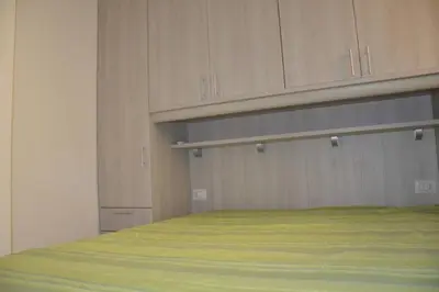 Letto o letti in una camera di FPO-FIO06PT delizioso bilocale 4 pax con veranda