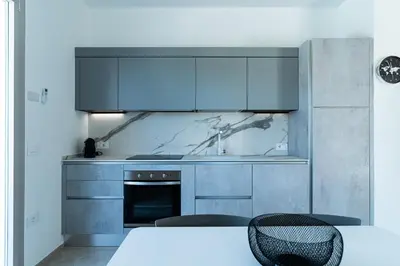Cucina o angolo cottura di Le Conchiglie Apartments with Pool by Wonderful Italy