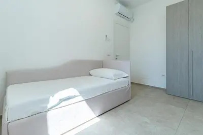 Letto o letti in una camera di Le Conchiglie Apartments with Pool by Wonderful Italy