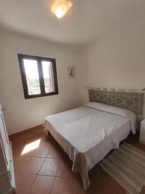 Letto o letti in una camera di Le Villette di Lu Fraili