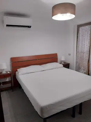 Letto o letti in una camera di Fpo-Fio42tp Casa su due Piani, 6 Pax A Ottiolu