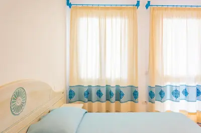 Letto o letti in una camera di ISA-Appartamenti Baia Marina