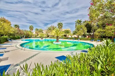 Piscina di Residence with swimming-pool in Ottiolu just 250 mt from the sea o nelle vicinanze