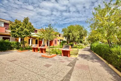 Giardino di ISA-Residence with swimming-pool in Ottiolu just 250 mt from the sea, apartments with air conditioning and private outdoor area