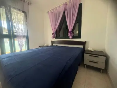 Letto o letti in una camera di fta-aga144p1 casa 4 posti vicino al mare Budoni