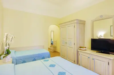Letto o letti in una camera di Nicolaus Club Li Cucutti