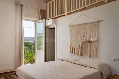 Letto o letti in una camera di Villa Canto Antico