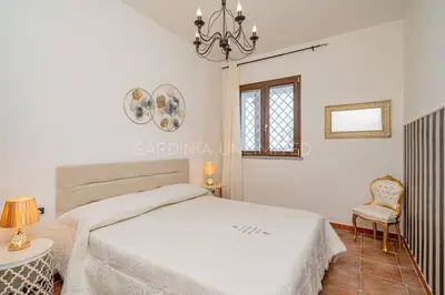 Letto o letti in una camera di Villa I Venti di Molara