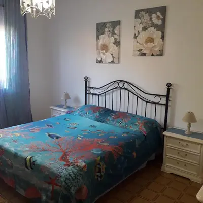 Letto o letti in una camera di Villa Gemma 1 via Donnigheddu 4