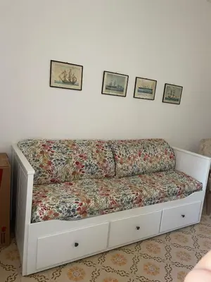 Letto o letti in una camera di Villa Gemma 1 via Donnigheddu 4