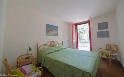 Letto o letti in una camera di Hotiday Apartments Case Bianche