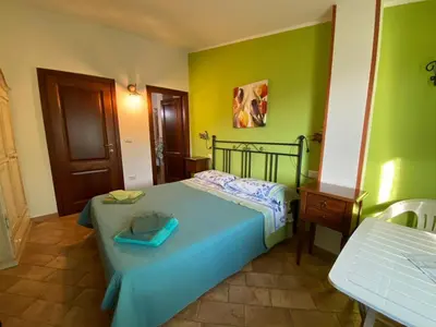 Letto o letti in una camera di B&b Su Acu