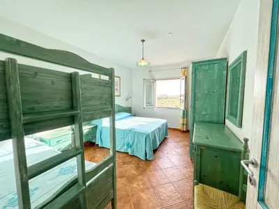 Letto o letti in una camera di Apartments In Golfo Orosei