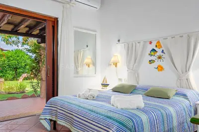 Letto o letti in una camera di Villa Beth
