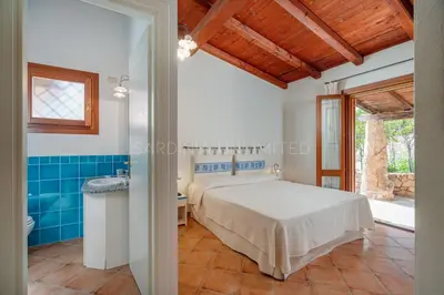 Letto o letti in una camera di Villa Saila