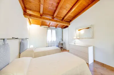 Letto o letti in una camera di Villa Salinedda