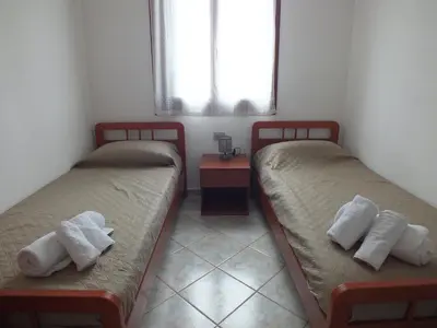 Letto o letti in una camera di Casa Budoni gemütliche Ferienwohnung Zentral doch ruhig gelegen 1km vom Strand