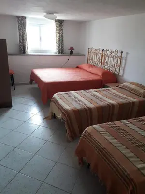 Letto o letti in una camera di Casa via Sardegna
