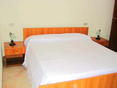 Letto o letti in una camera di Villa degli Ulivi e delle Rose
