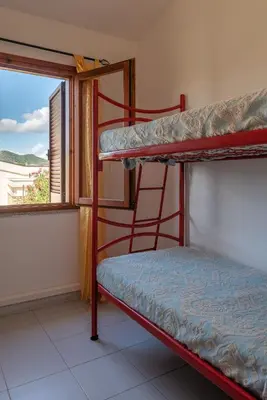 Letto o letti in una camera di San Teodoro Apartments