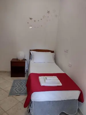 Letto o letti in una camera di Gardenia House