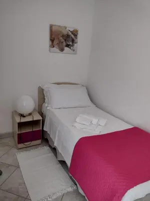 Letto o letti in una camera di Gardenia House