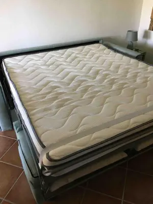 Letto o letti in una camera di Dolcevita, cozy apartment with patio and garden