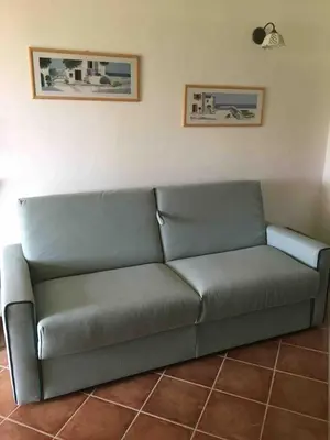 Area soggiorno di Dolcevita, cozy apartment with patio and garden