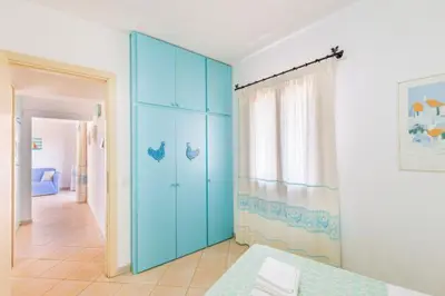 Letto o letti in una camera di Sardinia Blu Residence