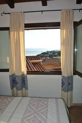 Letto o letti in una camera di Sardinia Blu Residence
