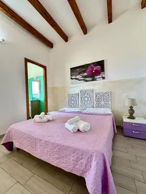 Letto o letti in una camera di AQUAMARE San Teodoro