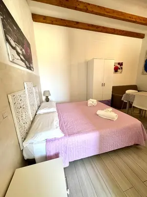 Letto o letti in una camera di AQUAMARE San Teodoro