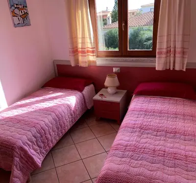 Letto o letti in una camera di Villa Pinna 2