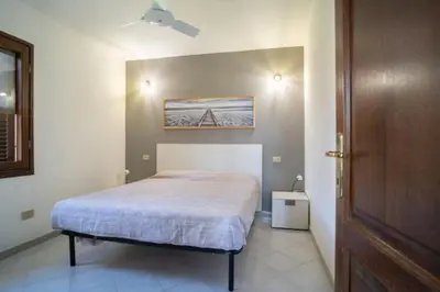 Letto o letti in una camera di La Cinta Apartments