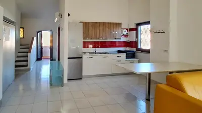 Cucina o angolo cottura di La Brezza Apartment 8 posti letto San Teodoro Centro