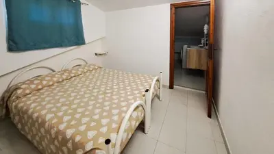 Letto o letti in una camera di La Brezza Apartment 8 posti letto San Teodoro Centro