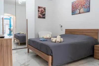 Letto o letti in una camera di Appartamento Dommo Amalia