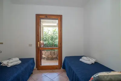 Letto o letti in una camera di Vista Tavolara 2