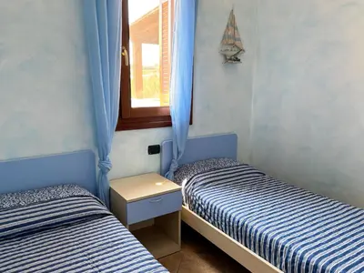 Letto o letti in una camera di Casa Marika