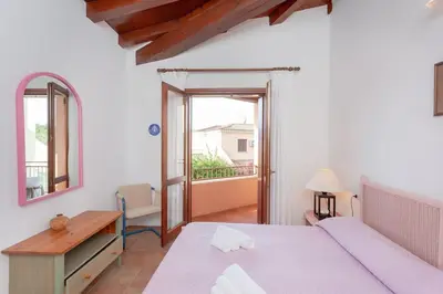 Letto o letti in una camera di Villetta Perla Marina 2