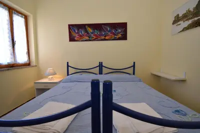 Letto o letti in una camera di Casa Nadia