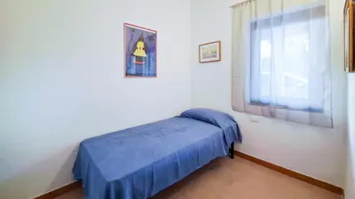 Letto o letti in una camera di DaDa House Trilocale La Suaredda di Supra San Teodoro
