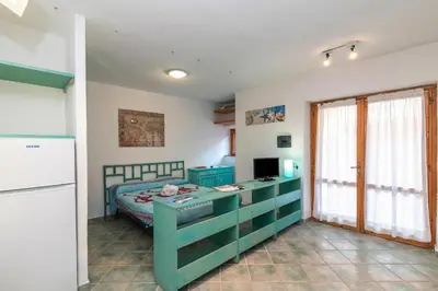 Area soggiorno di Piazzetta Mono Porto 50m From The Beach - Happy Rentals