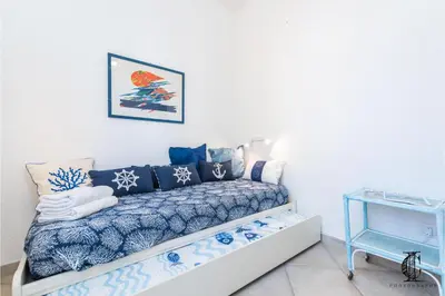 Letto o letti in una camera di Il Vecchio Faro A37 Close To The Beach - Happy Rentals