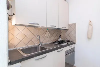 Cucina o angolo cottura di Il Vecchio Faro A37 Close To The Beach - Happy Rentals