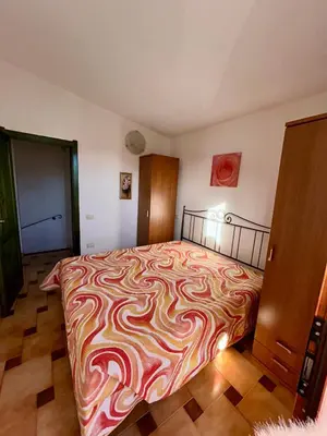 Letto o letti in una camera di Grazioso trilocale a Porto Ottiolu